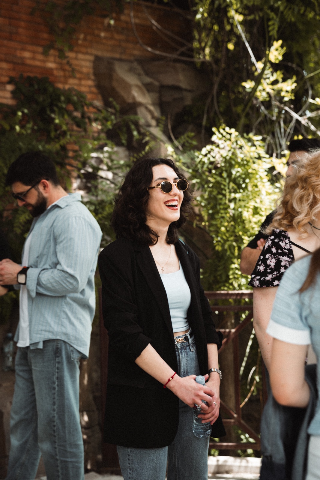 Laughing portrait outdoors, raw and graded